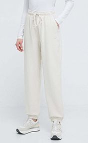 Spodnie dresowe New Balance  beżowe damskie WP41513LIN