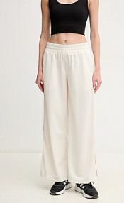 Spodnie dresowe Puma  beżowe damskie 629804