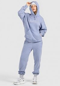 Spodnie dresowe niebieskie 4F damskie 4FRAW25TTROF1654-33S